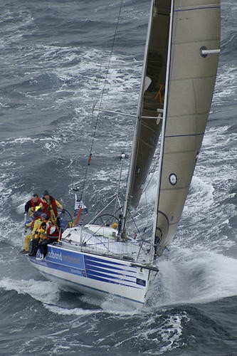 Melbourne to Vanuatu 2006, Ocean Skins an Inglis 47, owned and skippered by Tony Fowler ( Pictured on the wheel). The only Geelong entrant in the fleet. They were well rugged up with bitter cold southerly winds heading out of the rip today shortly after the 12pm start off Portsea. Sydney entrant Andrew Short Marine lead the fleet to the rounding mark off Queenscliff, followed by Gusto, Helsal II and the Ocean Skins. The race will take approximately 2 weeks to complete, however they are travelling into warmer waters, where there wet weather gear can be packed away into the cabin.  - 2006 Queensland Gov South Pacific Boomerang Race Series © Teri Dodds http://www.teridodds.com